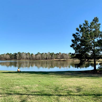 Boy sitting by the lake