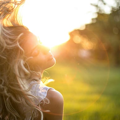 Lady tossing her hair outdoors