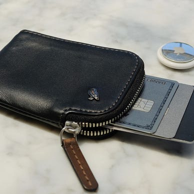 Black Bellroy Card Pocket with cards sticking out