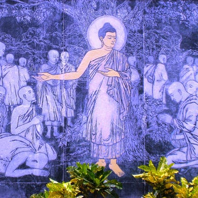 Purple-fluorescent wall painting of ‘The Buddha preaching The Dhamma’ at Dhamma Igatpuri