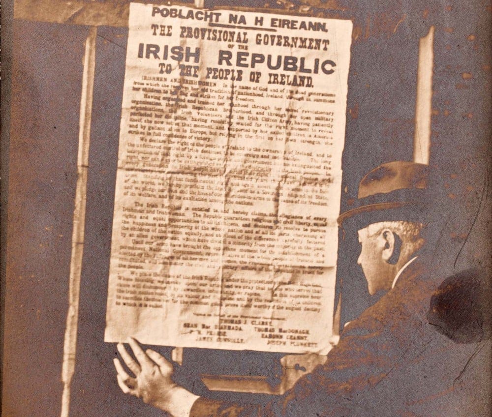 Dr. Edmund J. McWeeney reading the 1916 Proclamation posted on the railings of his home at 86 St. Stephen’s Green