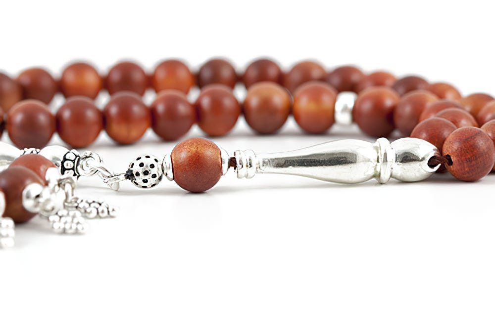 What is the significance of a rosary bead and why do people use them