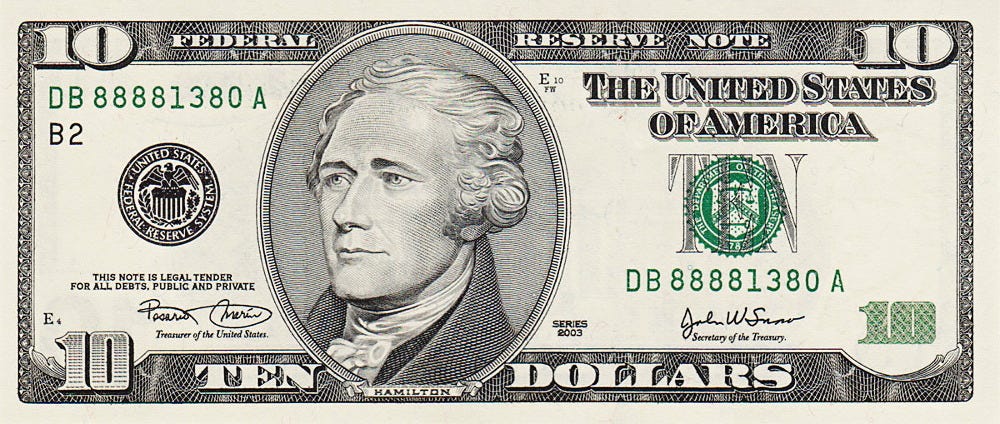 Pack of ten dollar bills with $1000 paper currency strap Stock