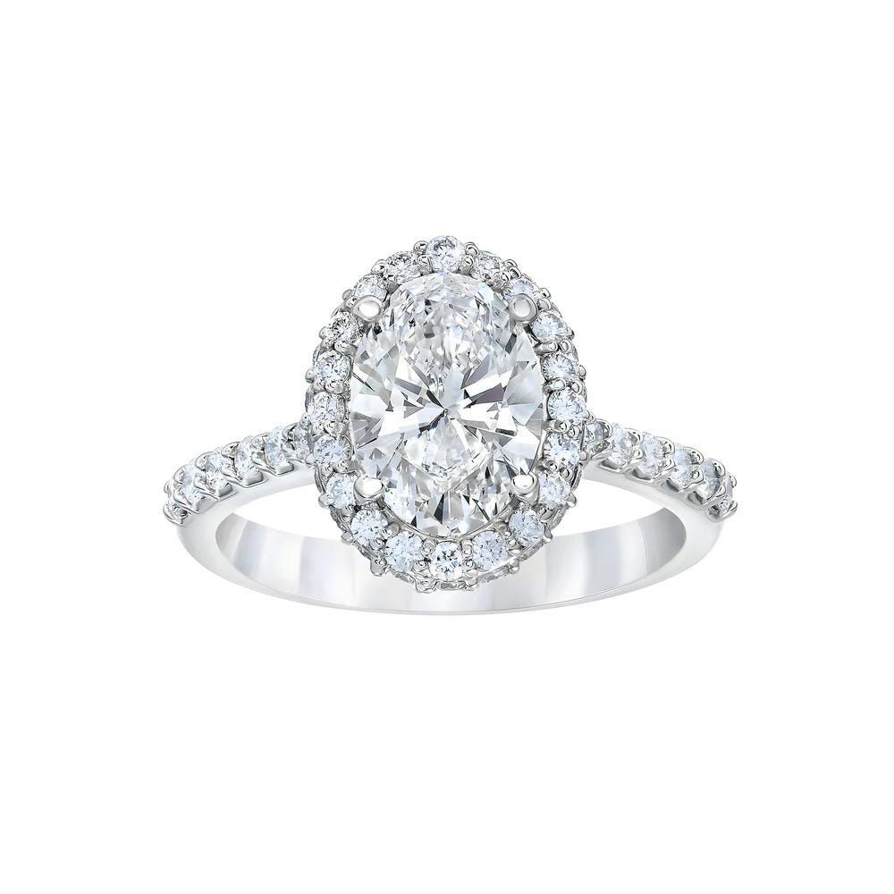 Oval Shaped Diamond Halo Engagement Ring in Platinum — Dop & Tang