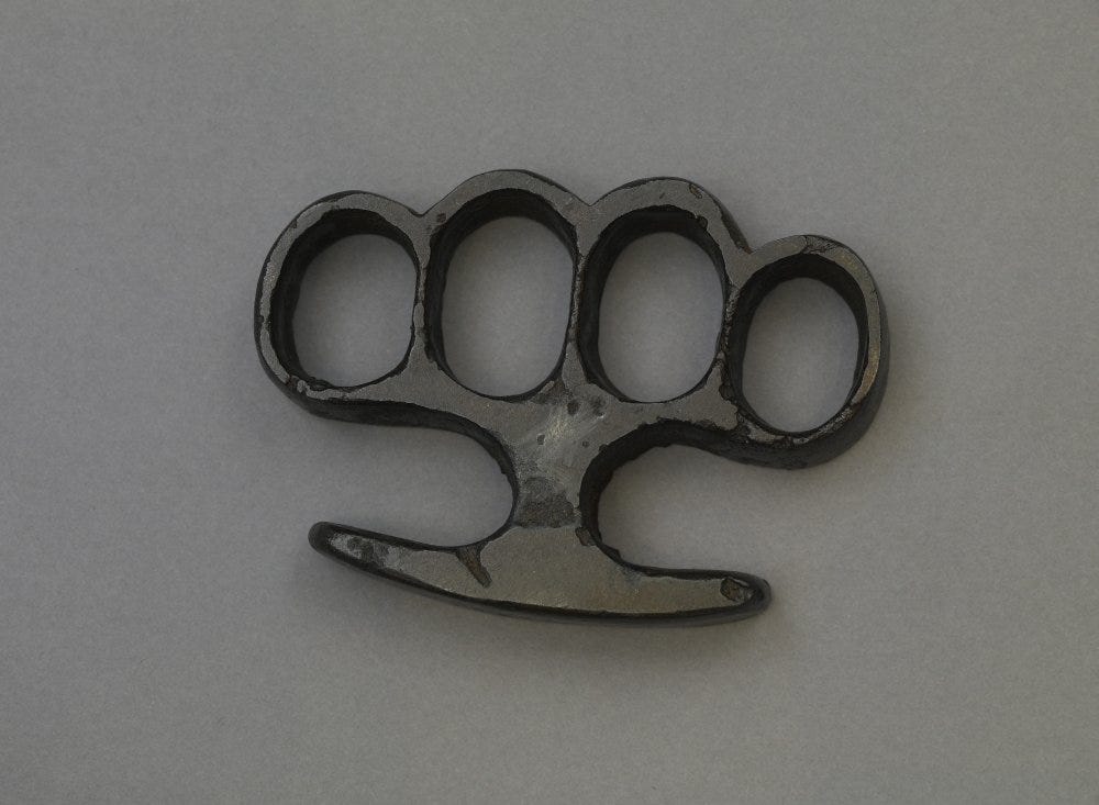 OK, what is this thing. Sharp brass knuckles? A tool of some sort