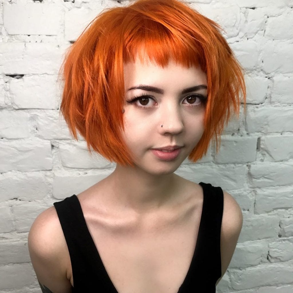 Short Choppy Bob with Micro Bangs and Messy Straight Texture on Fiery  Sunset Orange Colored Hair | by Hairstyleology | Medium