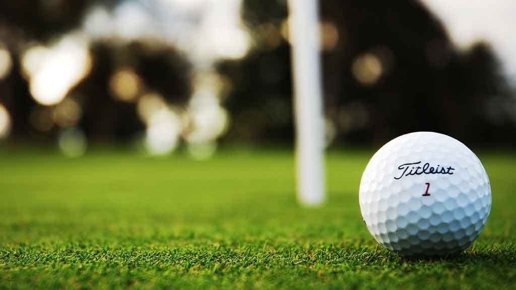 Why do golf balls have dimples and how do they help the ball fly