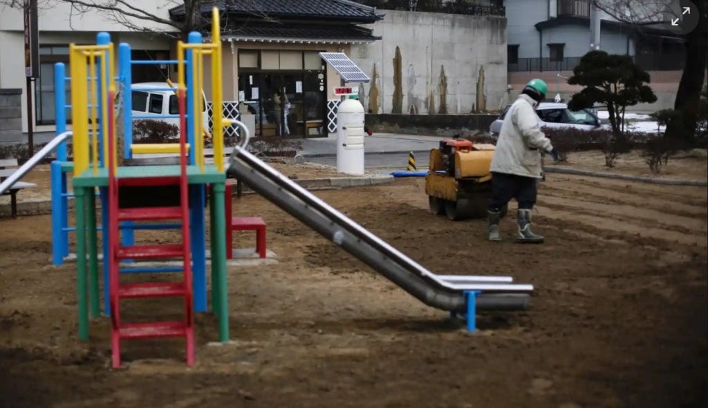 A man uses a roller near a Geiger counter, measuring a radiation level of 0.207 microsieverts per hour, during nuclear radiation decontamination work at a park in Koriyama. Photograph: Toru Hanai/Reuters