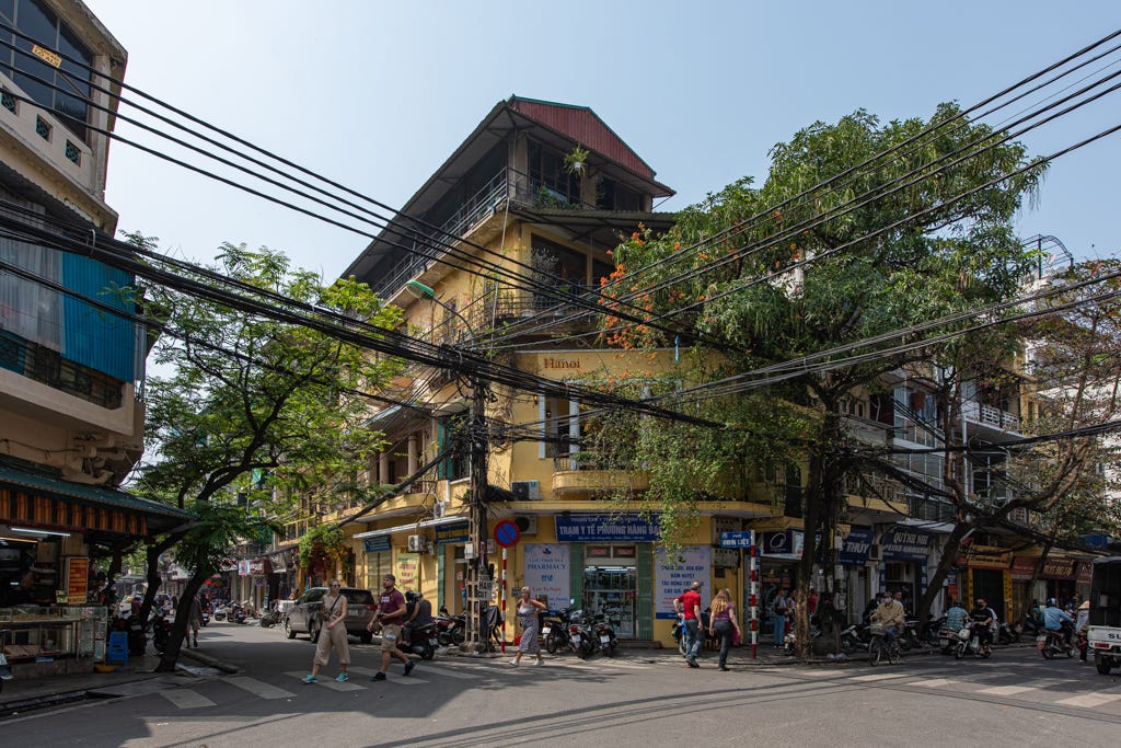 Crossing the road in Hanoi's old quarter, Hanoi, Vietnam Stock