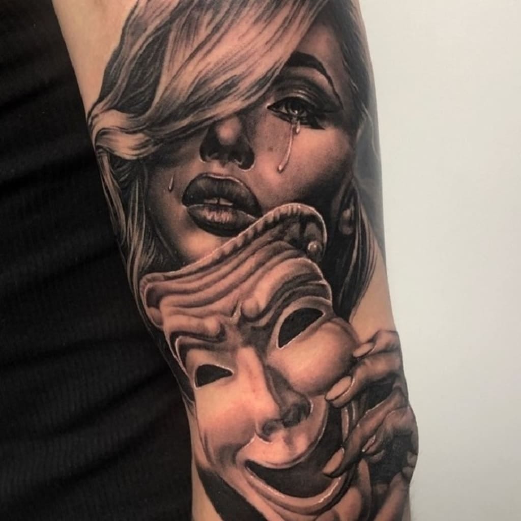 Laugh now, cry later tattoo meaning, by Sandeep Kumar