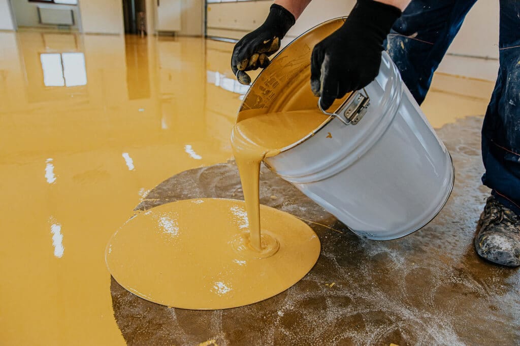 Epoxy flooring tools, preparation, and application of epoxy resin green  Stock Photo