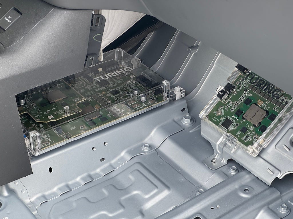 Two Turing AI chips under the center console and one under the front passenger’s feet for a total of 2,250 TOPS on this Ultra version of the X9. // Source: Nicolas Declunder