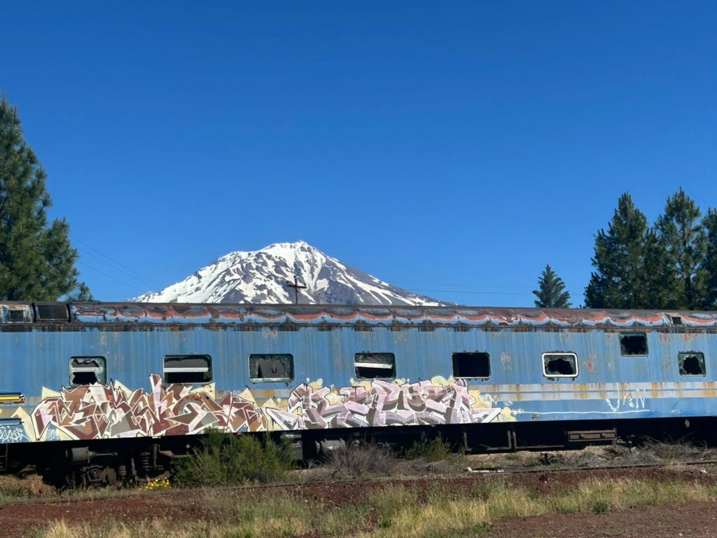 The remains of an old railroad with shining Shasta in background. The railroad was establlished around 1895, making it easier to transport lumber.