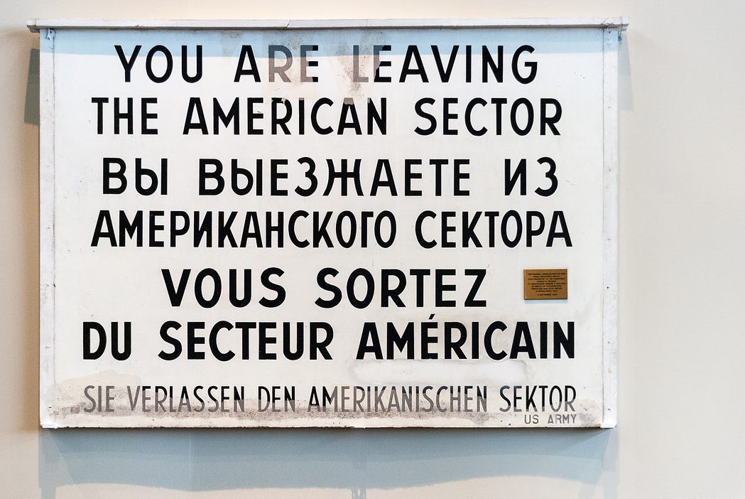 Sign  in four different languages. 