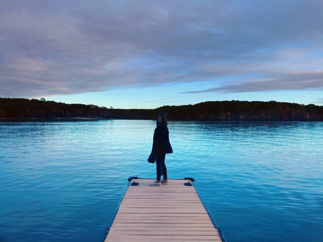 Deena on dock on blue lake