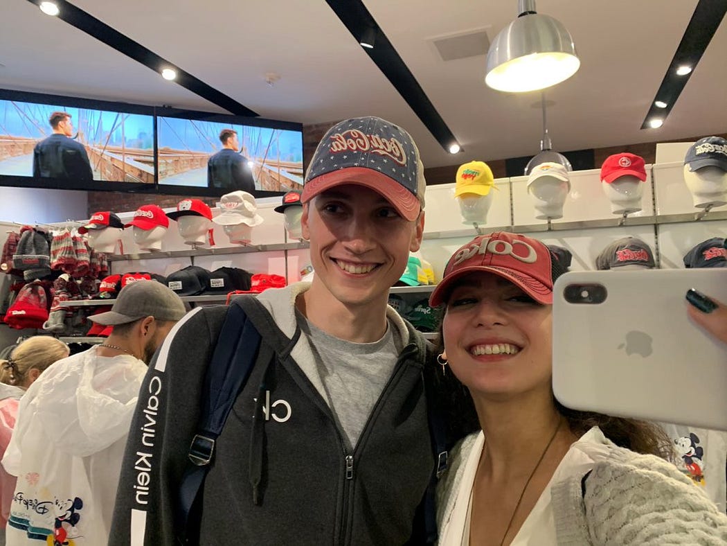 People taking selfies with hats.