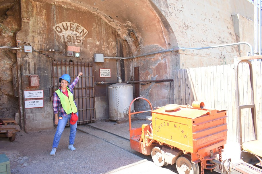 Woman posing in front of a mine.