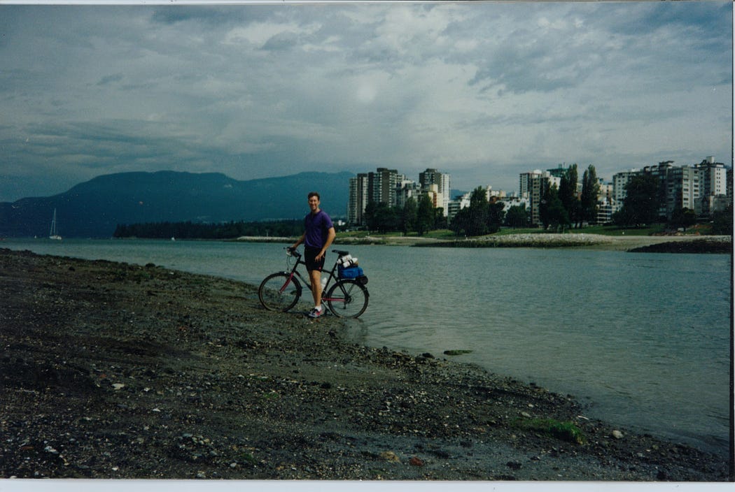 Me in Vancouver, British Columbia, back wheel of bike in Pacific Ocean, June 1992