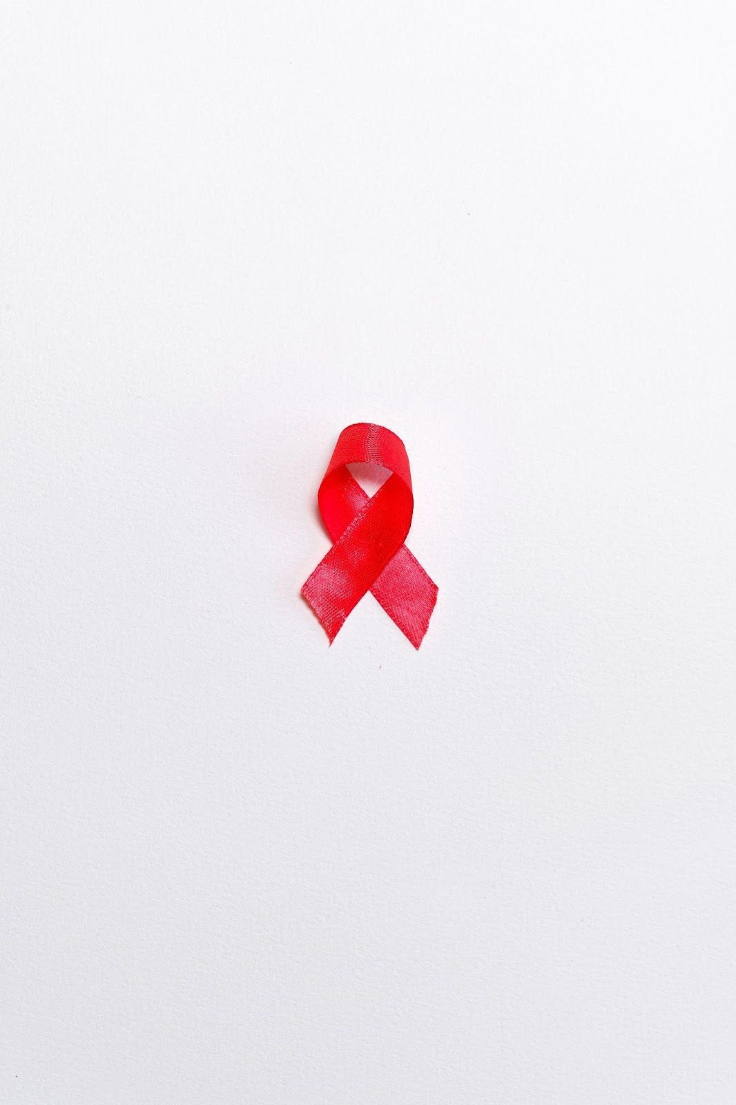 The red ribbon is a symbol to elevate people’s understanding of AIDS and break existing stigmas. (Photo credit: Pexels)