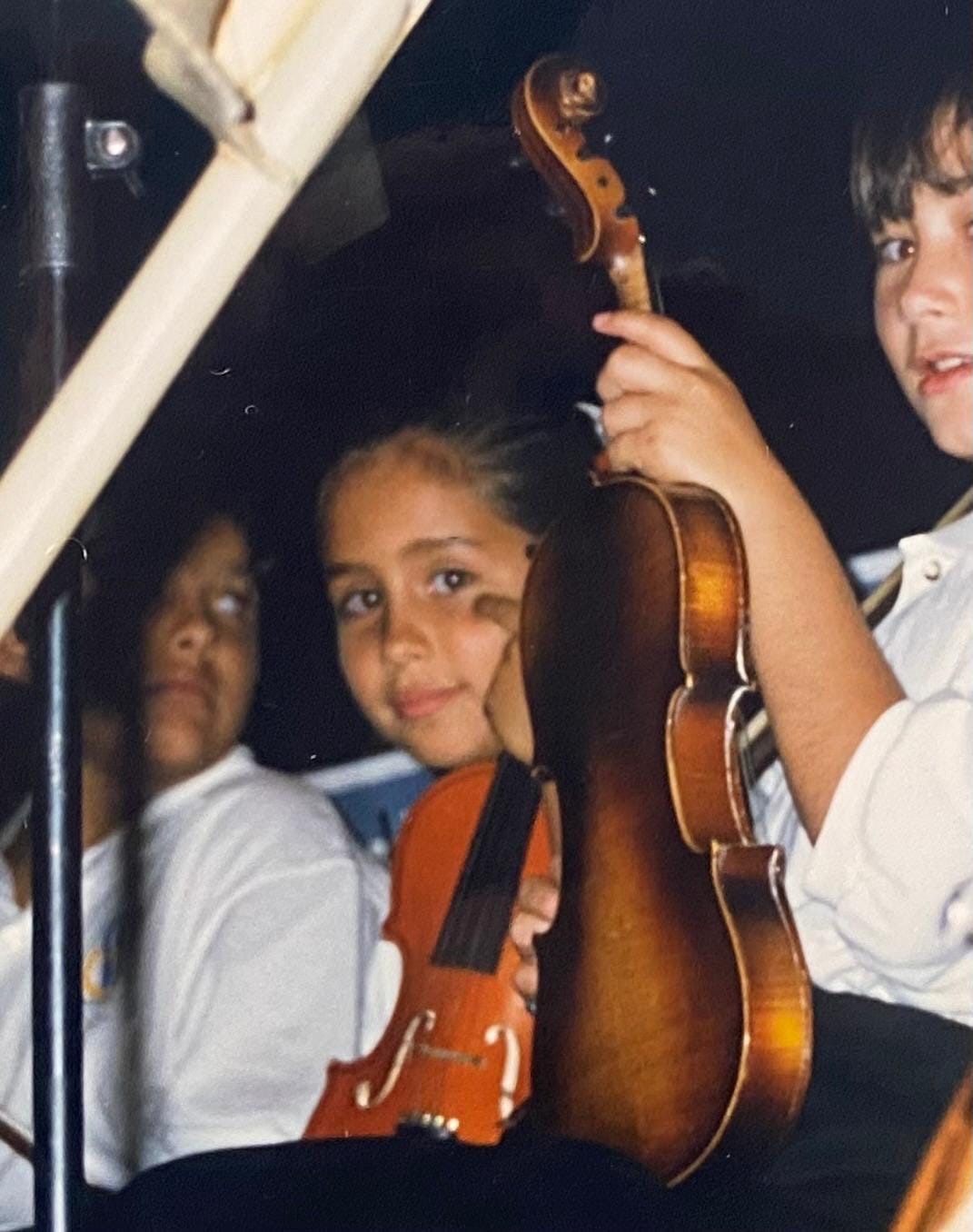 A young Ximena playing violin at a concert in Ensenada with the Baja California Youth Symphony.