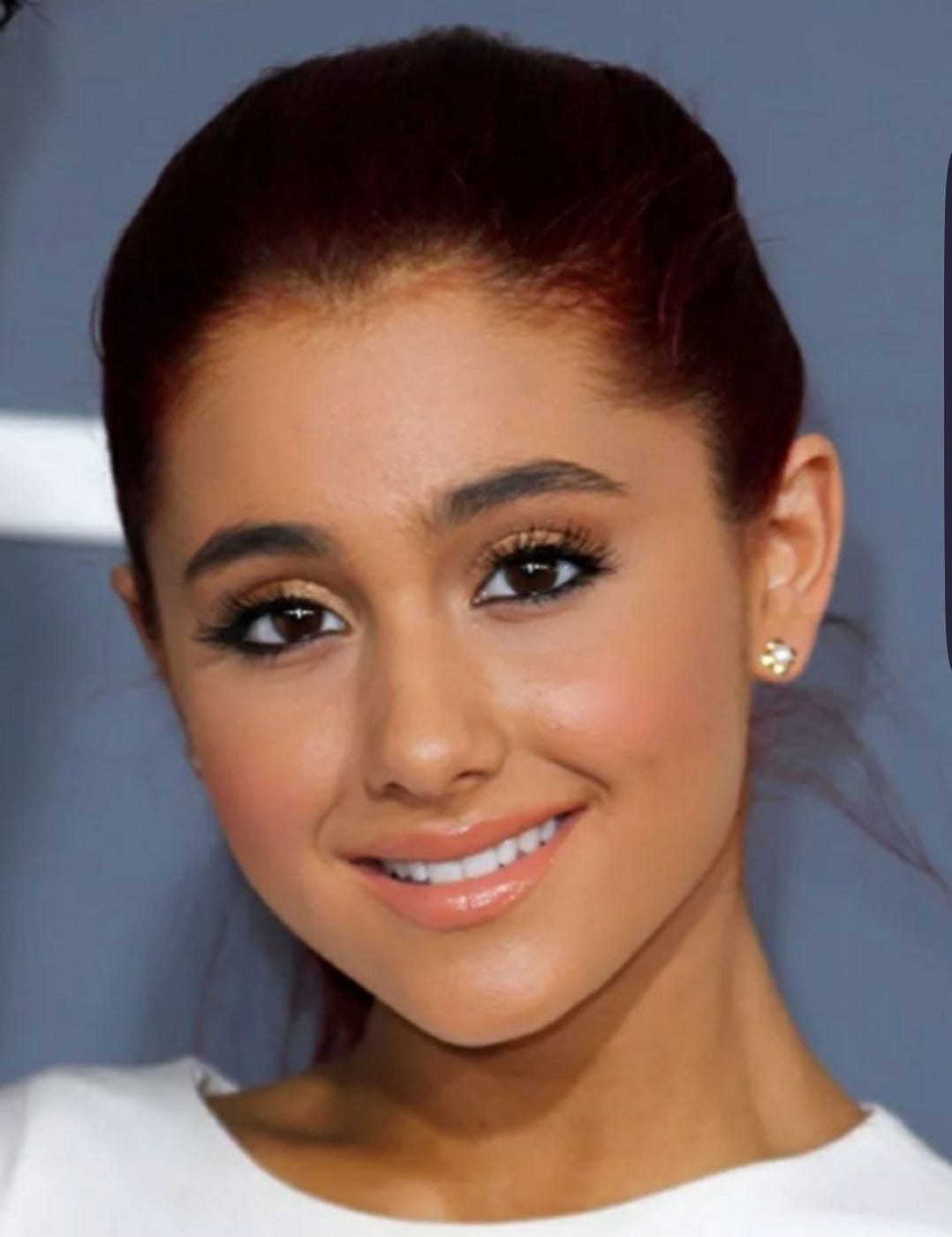 Aside from a tan, why does Ariana Grande's face look so different? So