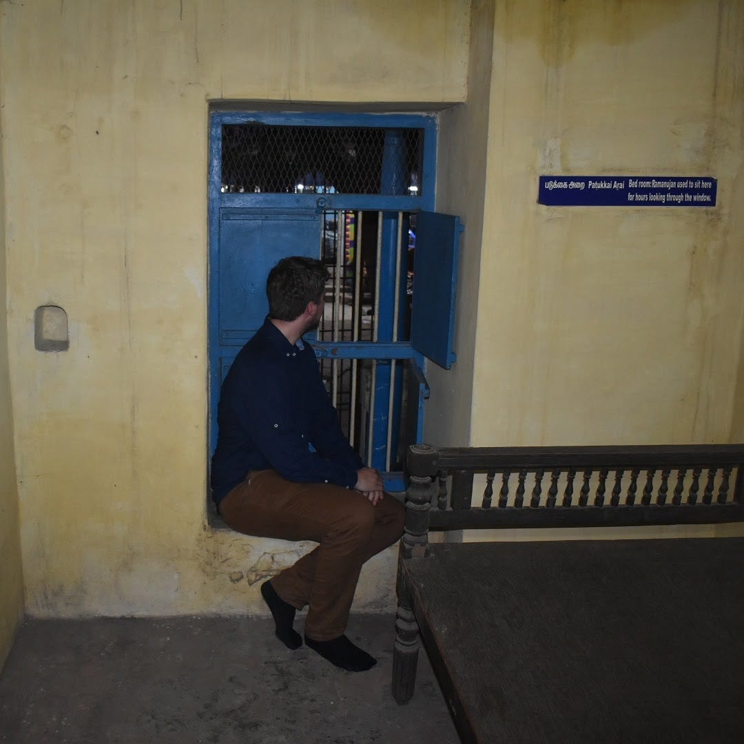 Time for introspection. Josh, sitting in Ramanujan’s childhood bedroom in Kumbakonam, India. Image Credit: Josh Males