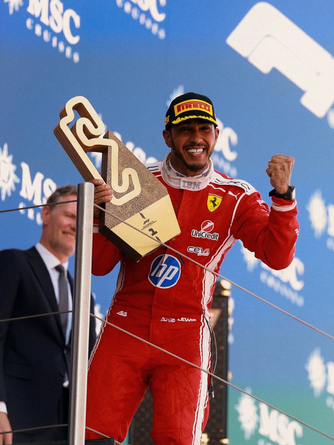 Lewis Hamilton with the first place trophy after finishing first at the 2026 Barcelon Grand Prix. Image via Lewis Hamilton on Instagram.