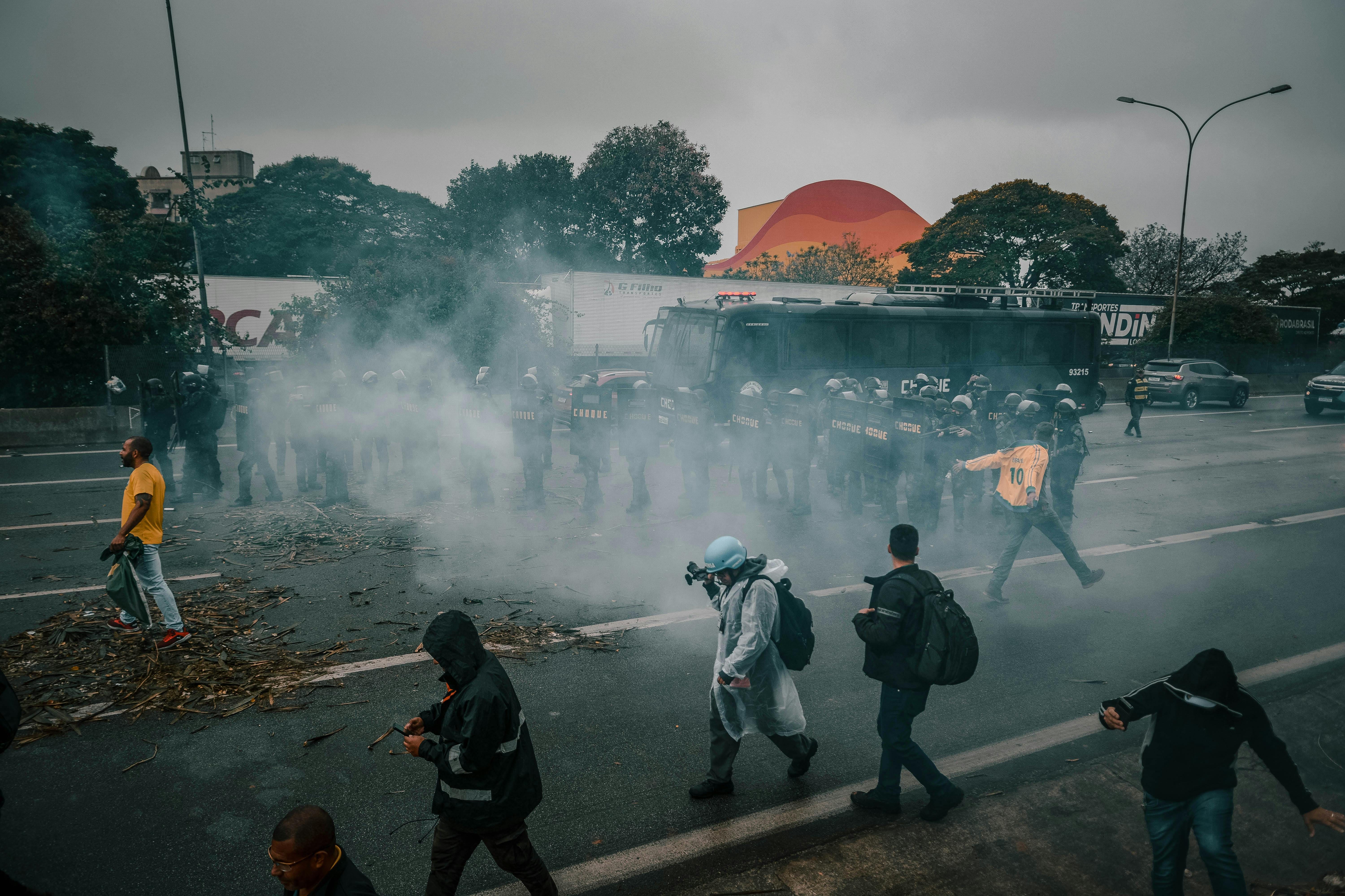 People on street with tear gas