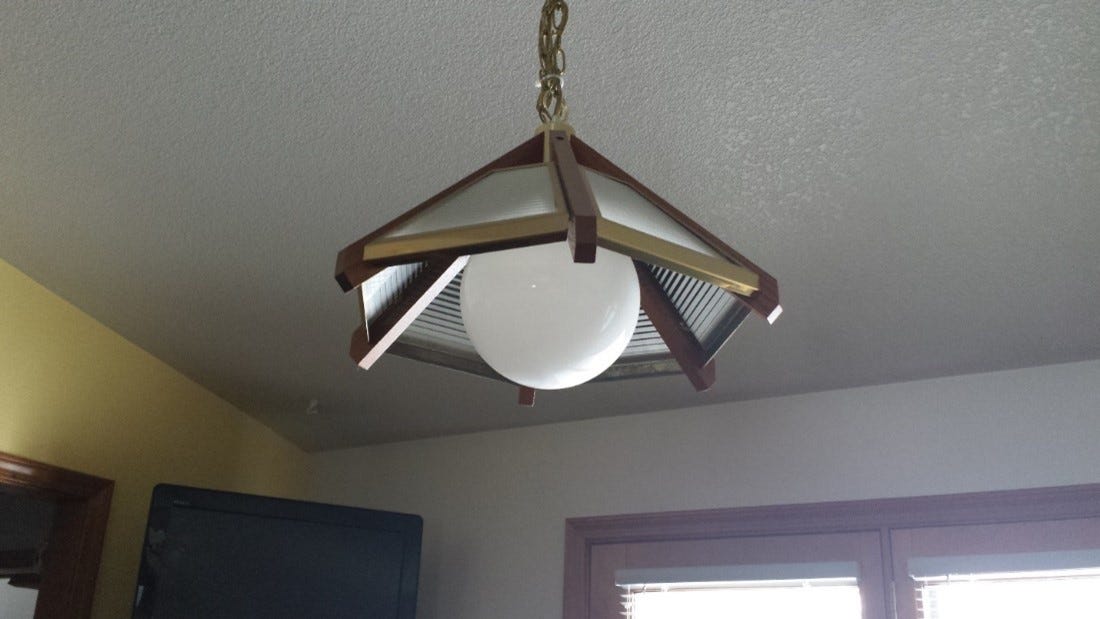Why We Can’t Ever Get Rid of This Ugly Light Fixture by Ginny Perez