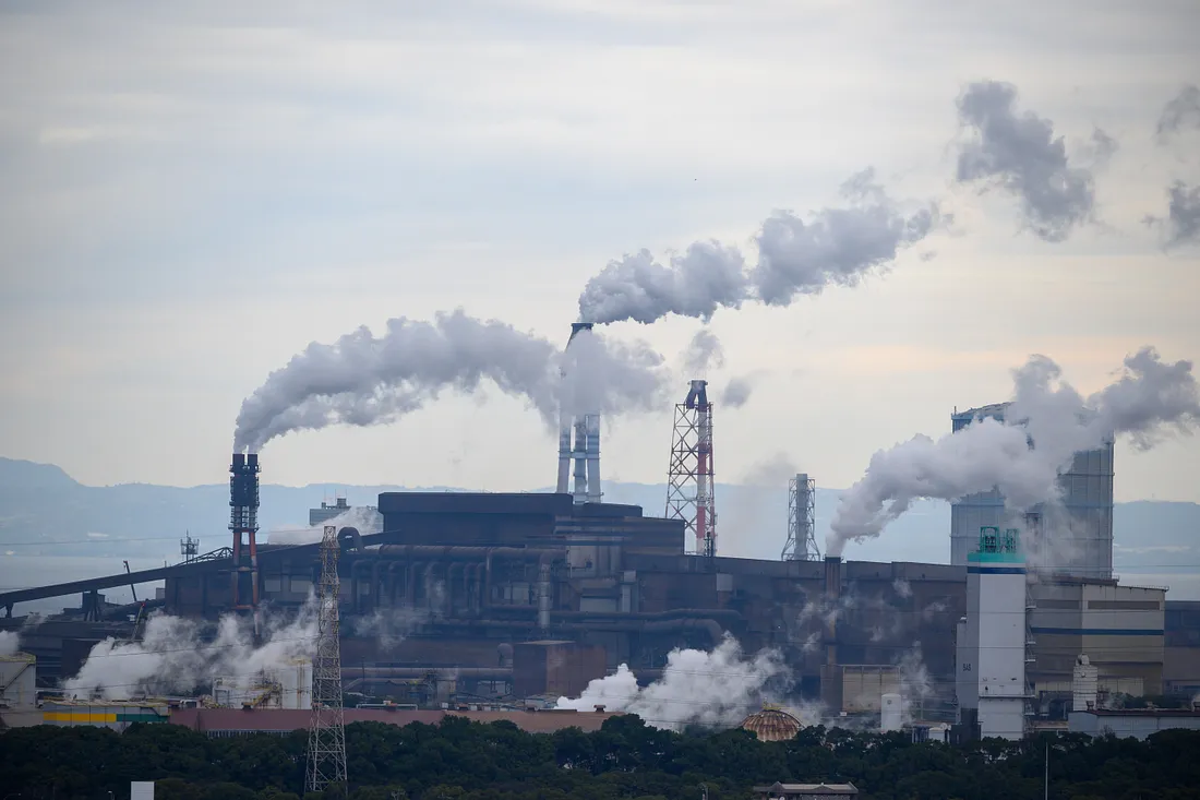 A large factory emitting carbon dioxide.