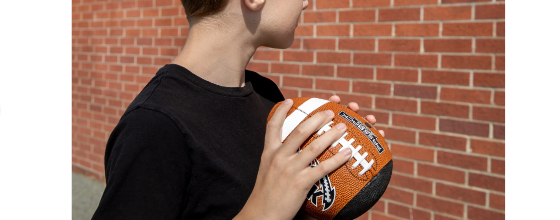 The Pass/Catch Training Football is advertised as “Composite Fatherless Bounce Back Youth Football”