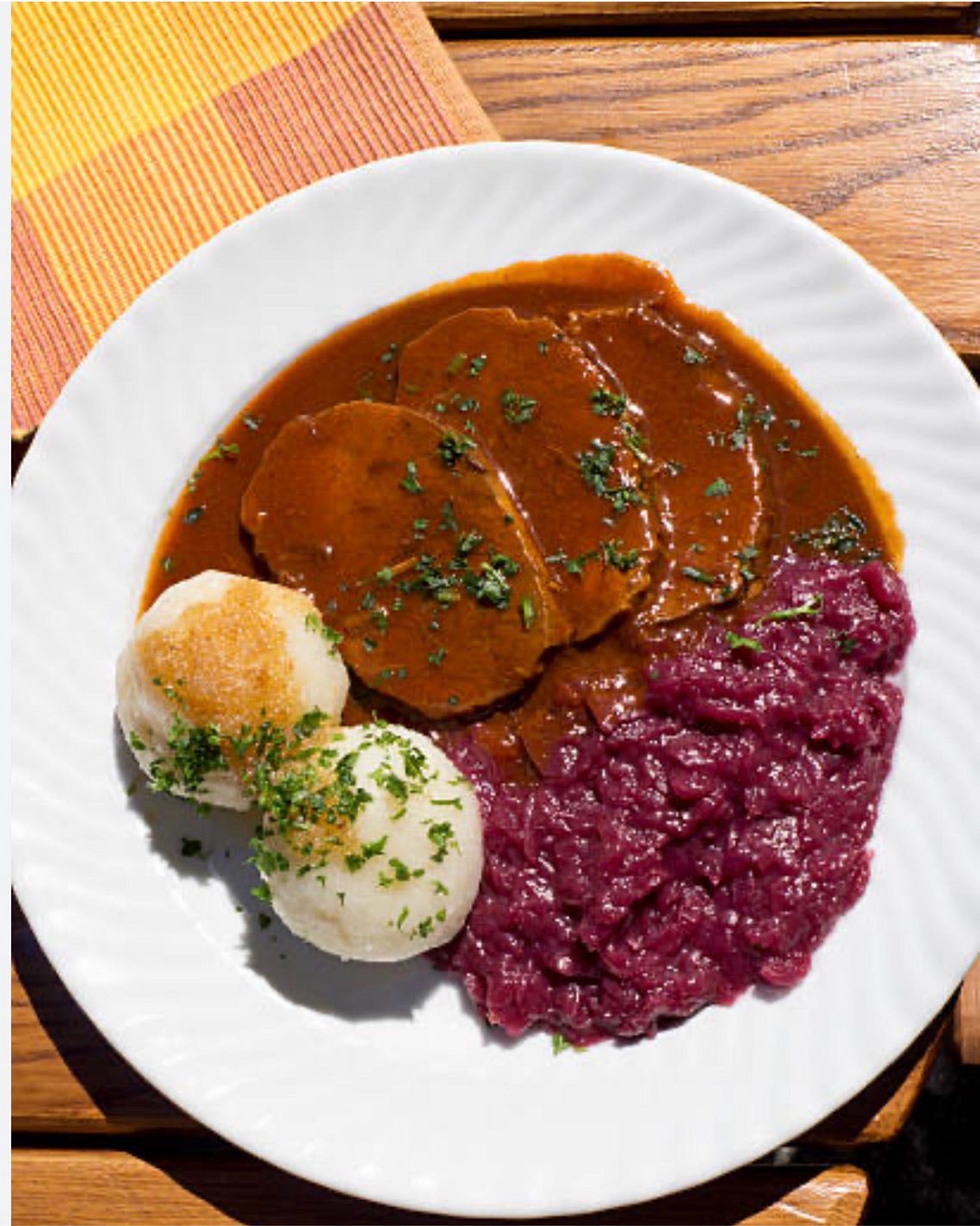 Pic from free Istock photos online — showing Sauerbraten, Kartoffel Klösse & Rotkraut