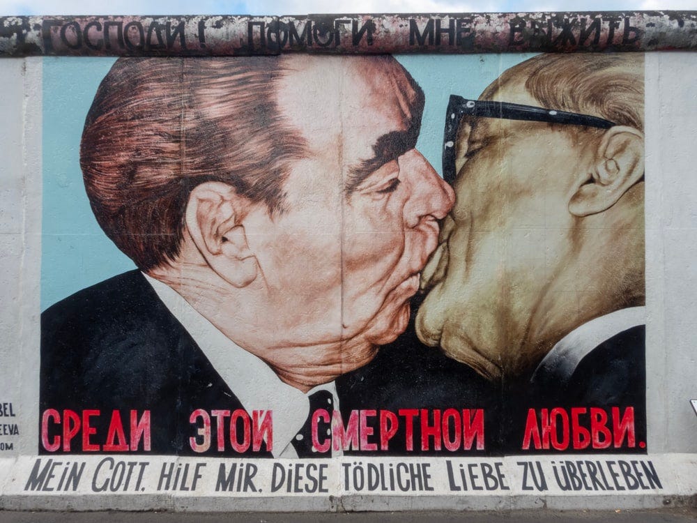 Satire, Erasure and Deadly Love: The story behind the Berlin Wall's  Fraternal Kiss | by Emily Walters | Medium