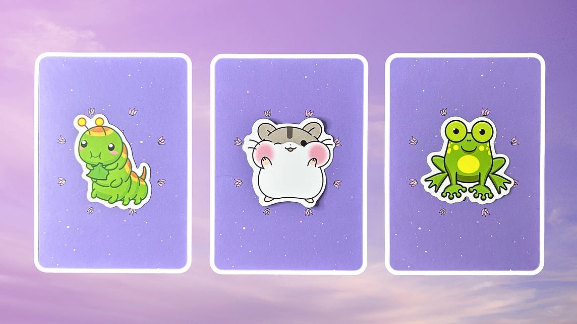 Three oracle pick a card piles with animal illustrations on them