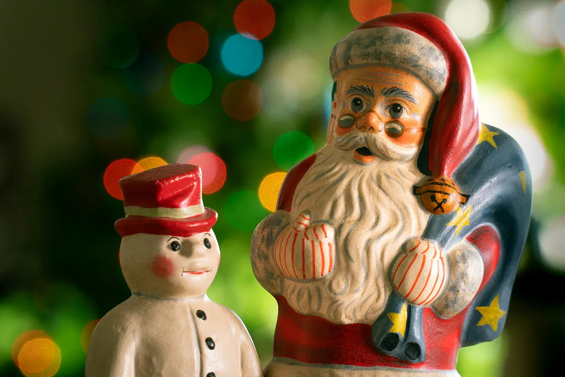 Santa Claus/Father Christmas and snowman figurines.