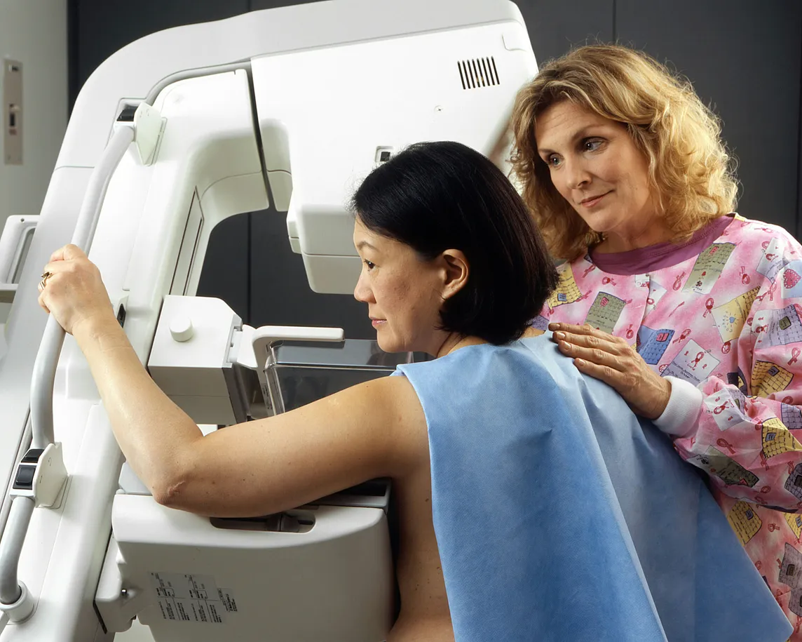 A woman undergoing mammography.