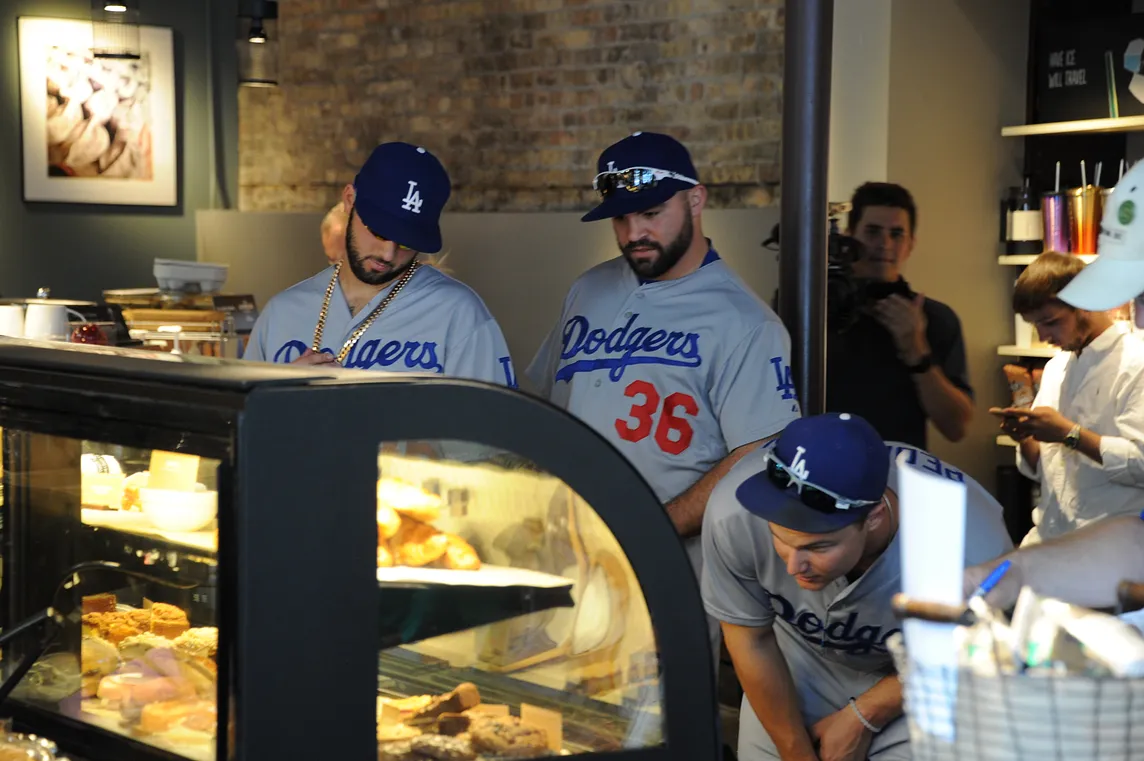 Adam Liberatore (center) joined Mike Bolsinger and Joc Pederson on a coffee run June 25 outside Wrigley Field. (Jon SooHoo/Los Angeles Dodgers). 