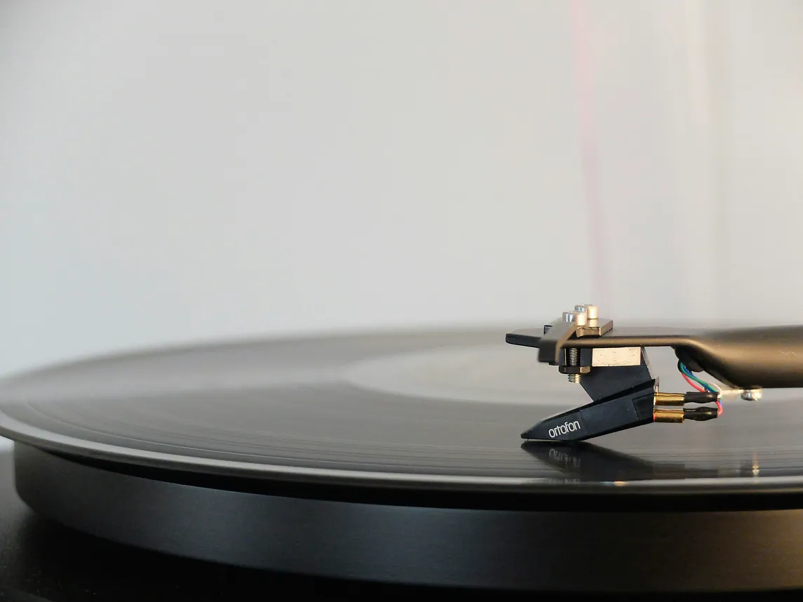 close up of a record playing on a record player