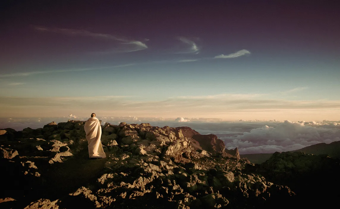 Man on mountain with sky