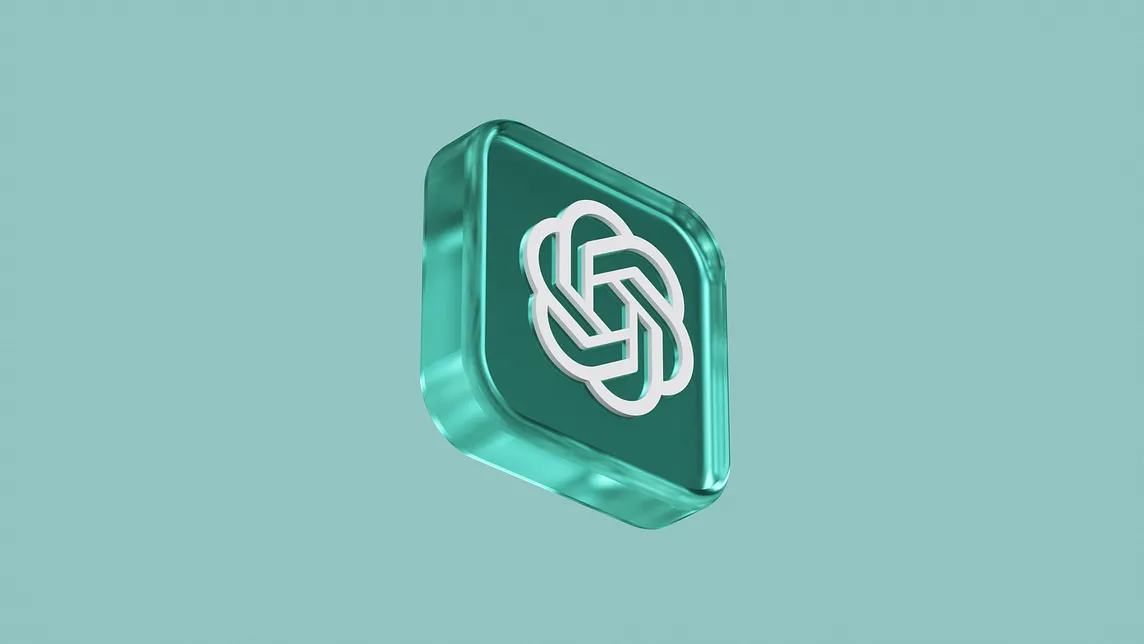 A three-dimensional, teal-colored cube with rounded edges on a lighter teal background. The cube features a white, stylized knot-like symbol with intertwining loops, representing connectivity, complexity, or infinity.