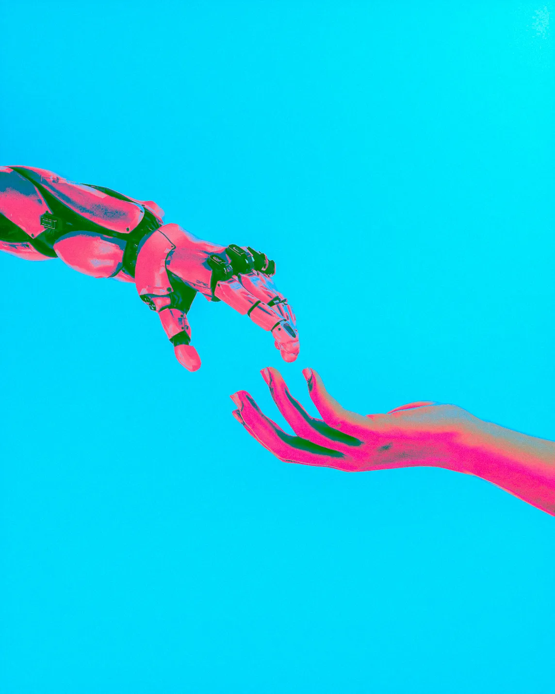 Robot hand reaching to human hand.