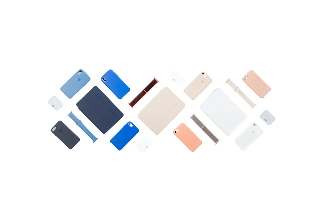 Coloured tablets, phones, and accessories facing face down