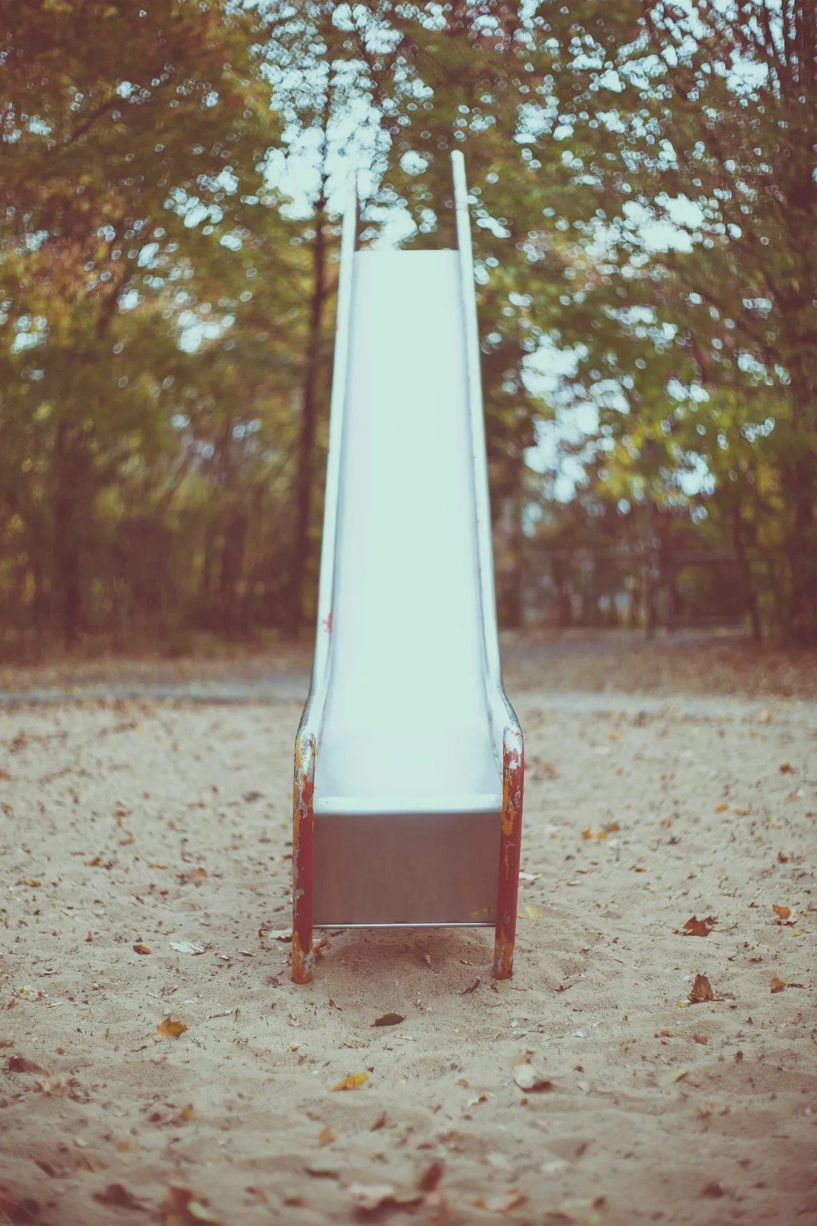 tall metal slide in a playground