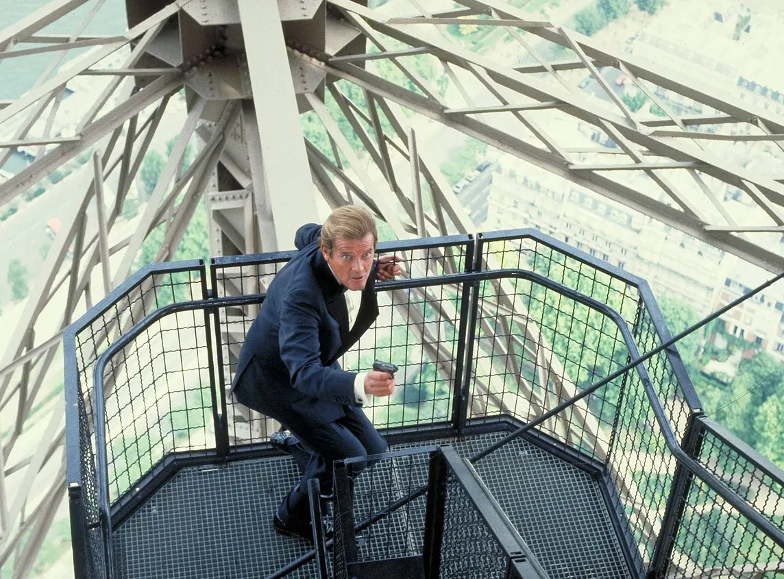 Iconic Bond moment as Moore in a dinner suit races around the Eiffel Tower in pursuit.