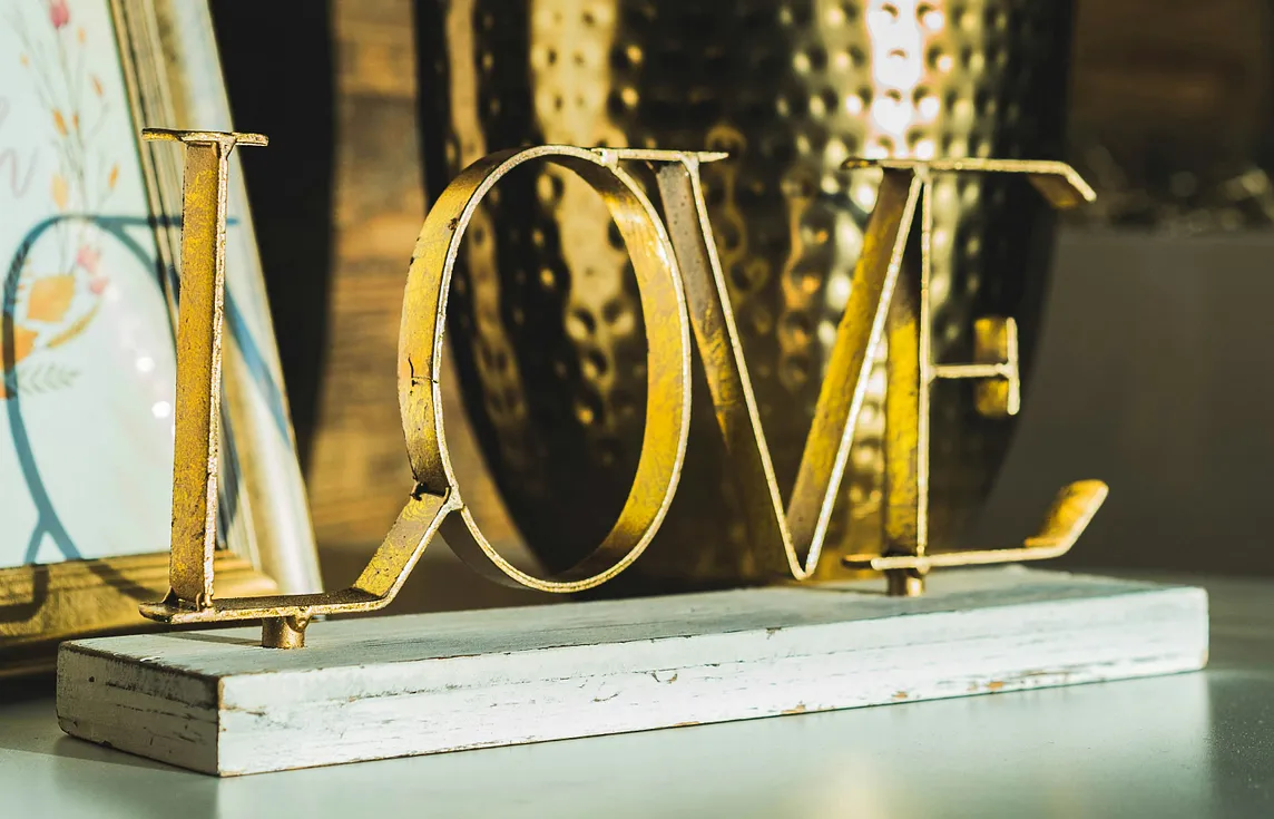 gold letters spelling love