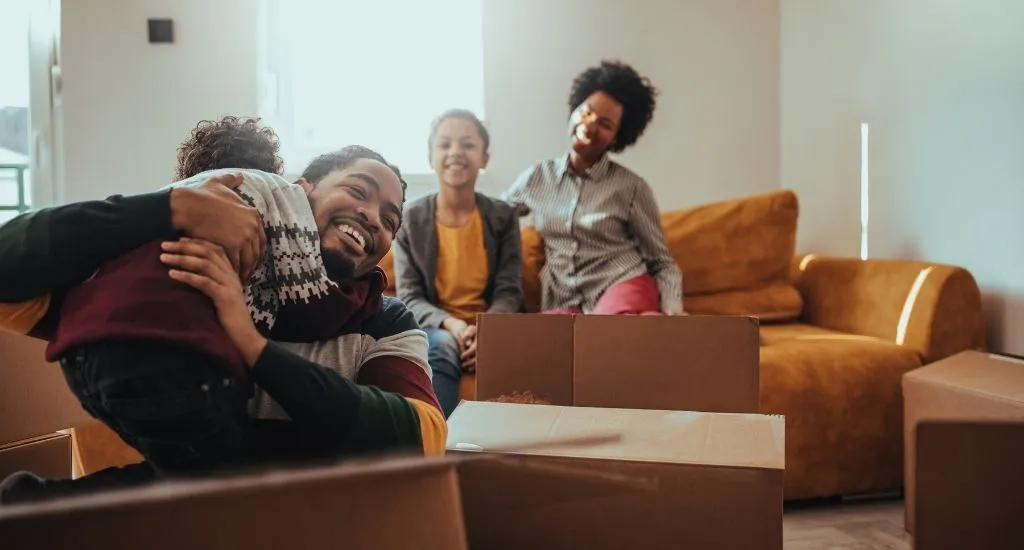 Family renting home full of moving boxes