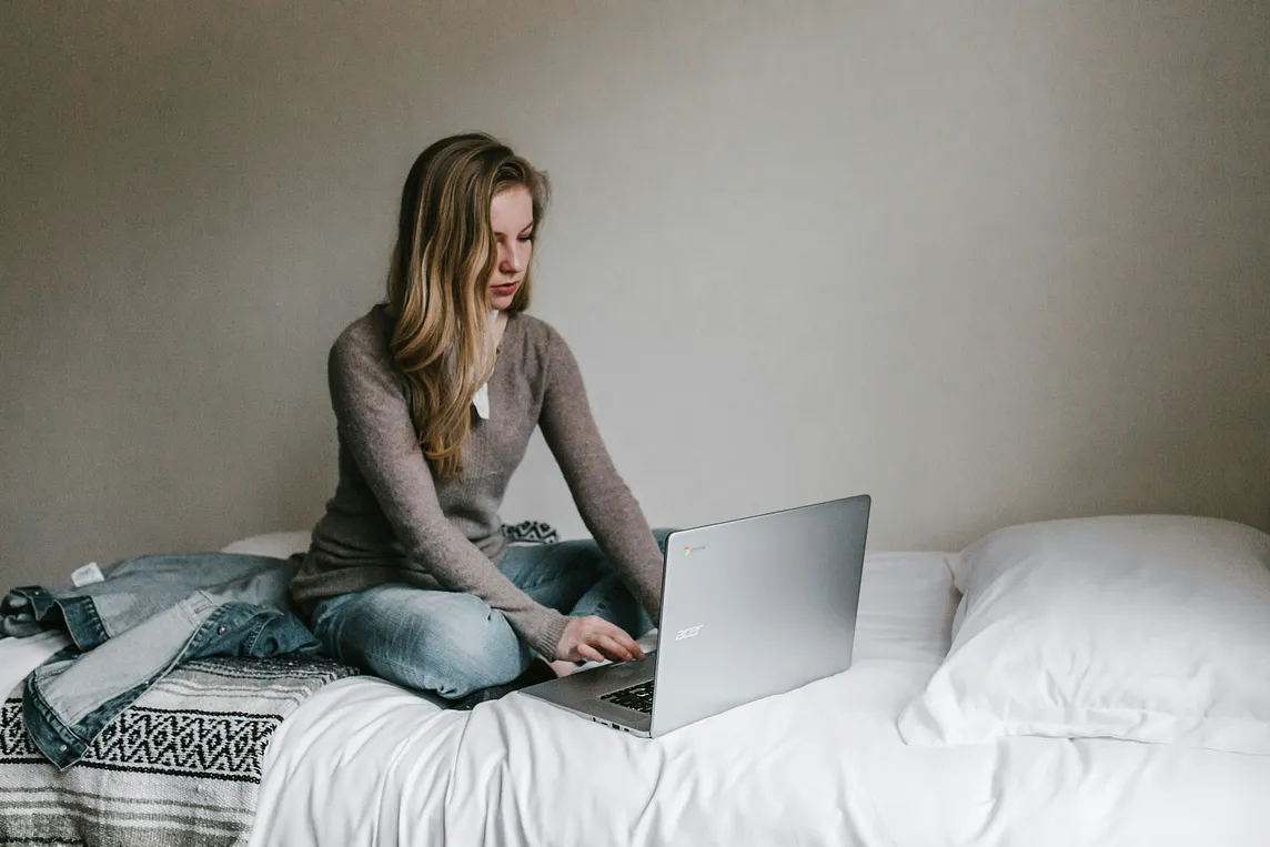 A woman working on a laptop