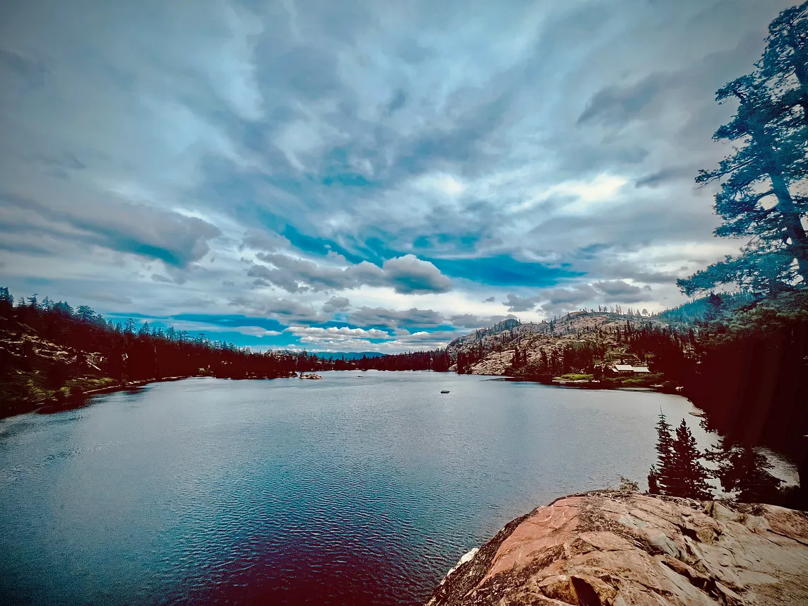 a picture of Mountain Lake under a partly cloudy sky
