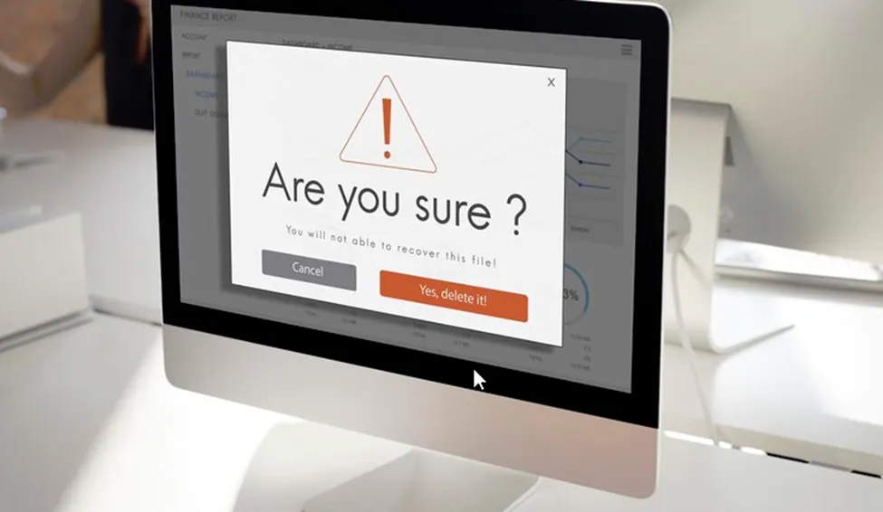 A photo of a computer screen with a large warning dialog box that asks “Are you sure?”