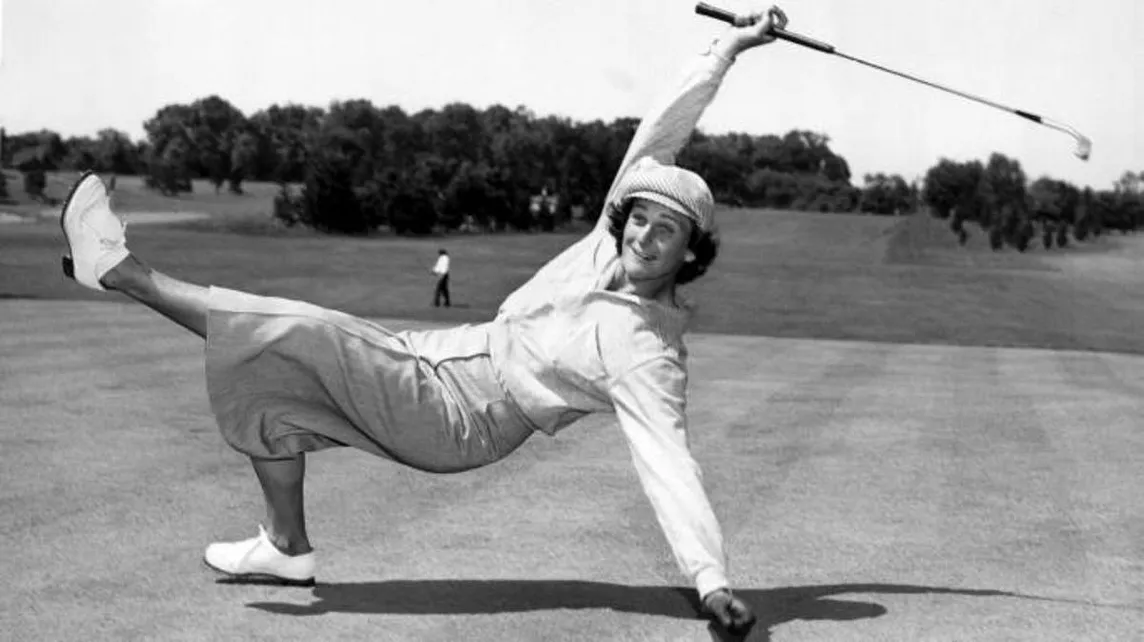 Babe Didrikson Zaharias athletically posed on a green